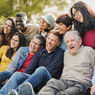 group of people sitting in the grass