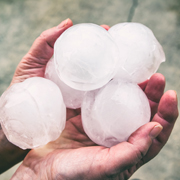 Large hail stones in palm of hand